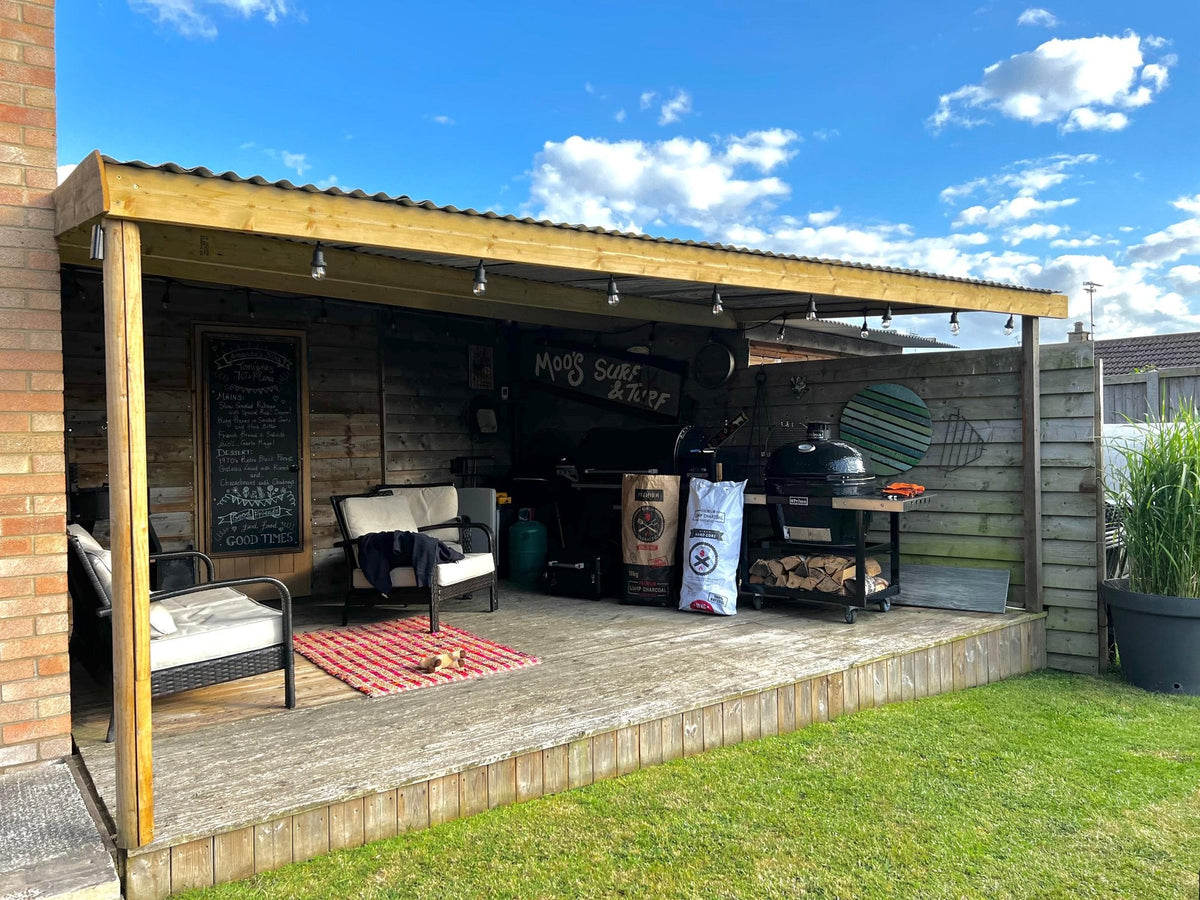 Garden outdoor kitchen with a kamado grill and Globaltic charcoal